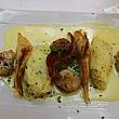Roasted scallops with cabbage and dried bacon crisps, herb-flavo